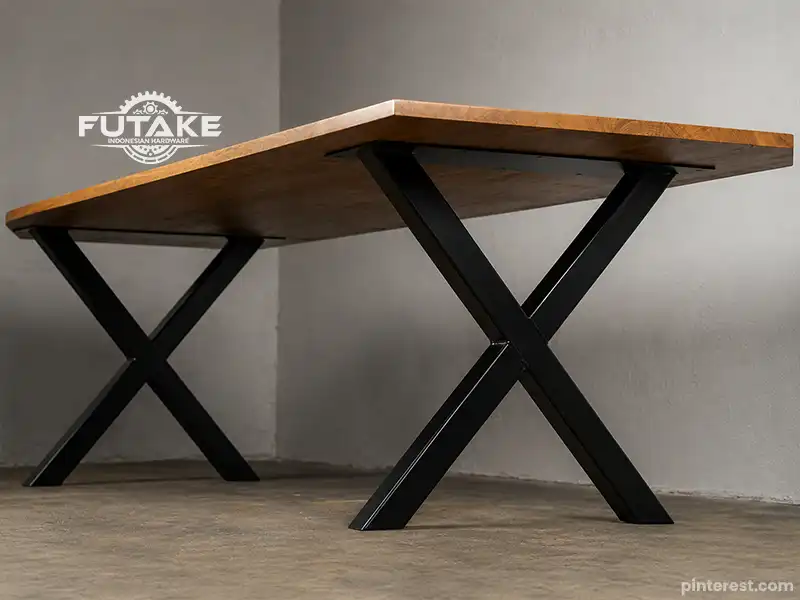 kaki meja model X frame yang memberikan tampilan gagah dan kuat menopang meja dengan tabletop besar